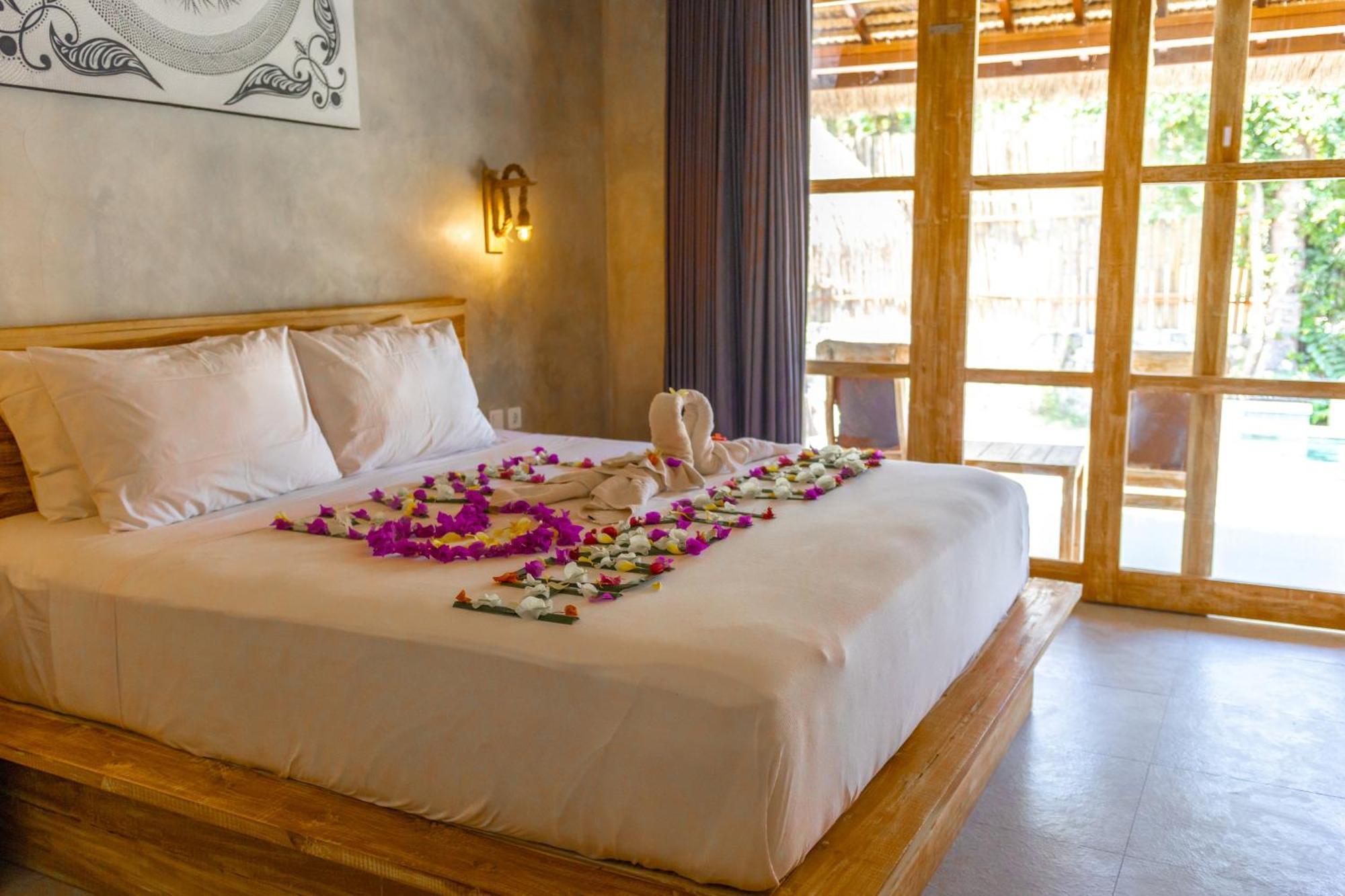 Golden Garuda Cottages Polilit Exteriör bild